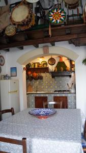 a kitchen with a table with a plate on it at Casa Margherita in San Vito lo Capo