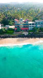 an aerial view of a resort on the beach at Beyond The Sea By Ceylonese in Ambalangoda