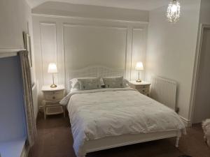 Un pat sau paturi într-o cameră la Meadowcroft