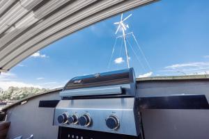 a stove top oven sitting on top of a trailer at Tabor 67 Luxury Houseboat in Ittre