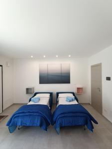 Un pat sau paturi într-o cameră la Villa Laura Holiday House 2