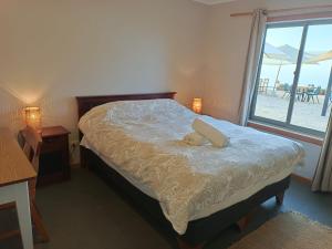 Postel nebo postele na pokoji v ubytování Hostal Quiriyuca Sur