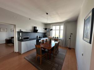 a kitchen and dining room with a table and chairs at apartament Mysłowice in Mysłowice