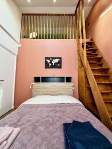 En eller flere senge i et værelse på Refuge familial Disney&Paris