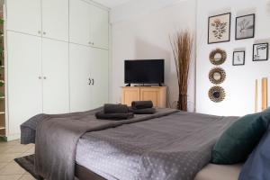 Ένα ή περισσότερα κρεβάτια σε δωμάτιο στο Evaggelia's Apartments 2 Διαμονή σαν το σπίτι σας