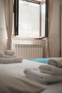 Posteľ alebo postele v izbe v ubytovaní Dimora Mariù - Casa Vacanze