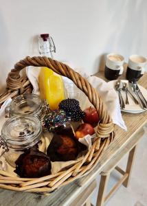 a basket of breakfast foods on a table at The Larch Room in Brandsby