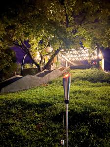 a street light in the grass at night at Casa Quincho ROMA in Salta