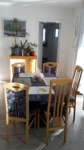 a dining room table with two chairs and a table and chairsktop at Otthonos Szállás in Stuttgart