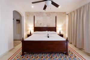 Postel nebo postele na pokoji v ubytování La Aurora Hotel Colonial