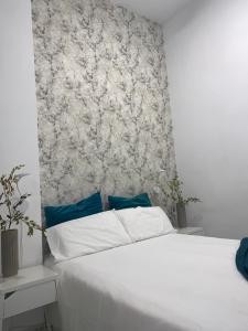 Ein Bett oder Betten in einem Zimmer der Unterkunft CASA PAPAGAYO