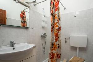 a bathroom with a sink and a toilet at Dimitris studios & apartments in Faliraki +41 photos