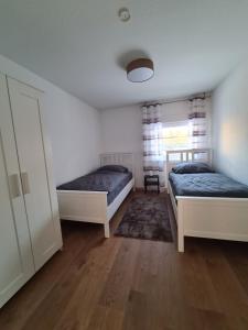 Postel nebo postele na pokoji v ubytování Ferienwohnung in Erftstadt Phantasialand, Köln, Köln Messe, Eifel