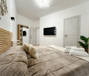 A bed or beds in a room at Colosseum Luxury Guest House