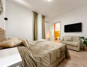 A television and/or entertainment centre at Colosseum Luxury Guest House
