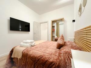 A bed or beds in a room at Colosseum Luxury Guest House