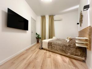 A bed or beds in a room at Colosseum Luxury Guest House