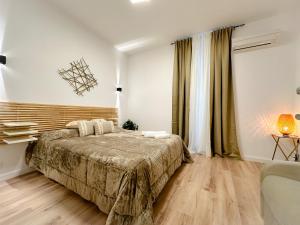 A bed or beds in a room at Colosseum Luxury Guest House
