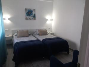 Posteľ alebo postele v izbe v ubytovaní Casa Patio Paraíso