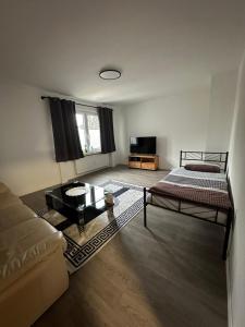 a living room with two beds and a couch at Oberhausen Apartments in Oberhausen