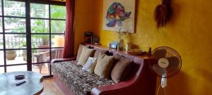 a living room with a couch and a table at Villas del Amor Amor in Puerto Vallarta