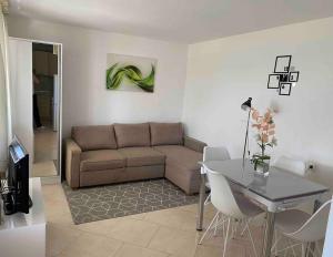 a living room with a couch and a table at Mediterranean Jewel in Blato