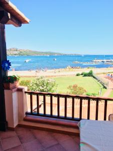 a balcony with a view of a beach and the ocean at Centro Servizi Marinella in Santa Marinella