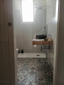 a bathroom with a sink and a bath tub at Casa Baia Santa Reparata - Santa Teresa di Gallura IUN Q1712 in Santa Teresa Gallura