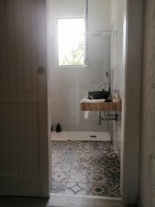 a bathroom with a sink and a window at Casa Baia Santa Reparata - Santa Teresa di Gallura IUN Q1712 in Santa Teresa Gallura