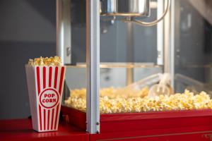a popcorn container sitting on a counter next to a window at Svyvo Cologne - Serviced Apartments Ehrenfeld in Cologne
