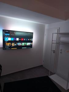 a room with a flat screen tv on a wall at Modern apartment cologne in Cologne