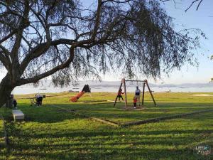 a group of people playing in a park at Casa en Playa Las Sinas in Villanueva de Arosa