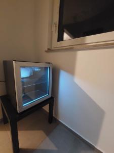 a television sitting on a table in a room at Modern apartment cologne in Cologne