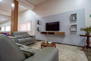 TV a/nebo společenská místnost v ubytování Hotel Dan Inn Barretos by Nacional Inn + 37 fotografií