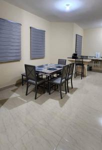 a dining room with a table and chairs at Residencia Familiar en Ciudad Constitución B C S in Ciudad Constitución