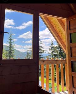 a view from the inside of a cabin with two windows at Čakorski Konaci in Berane