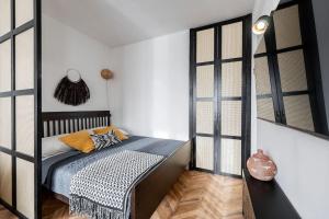 a bedroom with a bed in a room at Apartmán sladký domov in Košice