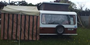 a van with a tent on top of it at Blissful Rental in Motueka