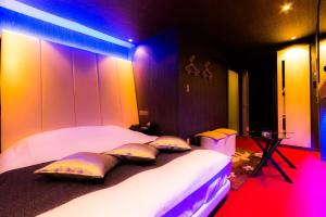Voodi või voodid majutusasutuse ホテルR-Adult only-lovehotel toas