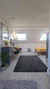 a living room with a mirror and a rug at Sidney Grove B&B in Newcastle upon Tyne