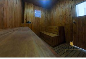 a room with a bed in a wooden cabin at Apartamento para pareja. in San Gil