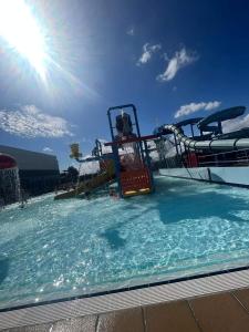a large swimming pool with a water park at 205 Holiday Resort Unity Pet friendly 6 berth passes included in Brean