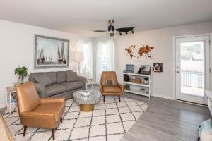 a living room with a couch and a chair at Cozy Coastal Home Near Beaches, Shops, Restaurants in Southport