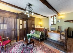 a living room with a couch and a table at Domaine Le Castelet in Castres