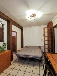 a bedroom with a bed and a ceiling fan at L'Cosy Suite - Charming 2BR in Bagnolet in Bagnolet