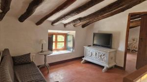 TV a/nebo společenská místnost v ubytování Casa rural Casa Montoya