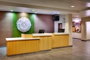 a lobby with a reception desk and a chandelier at Fairfield Inn & Suites Roswell in Roswell