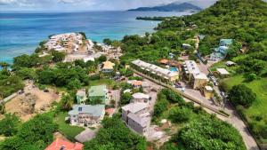 an aerial view of a resort next to the ocean at Cosy 1 Bd-Rm is steps away from Beach access. in Morne Rouge
