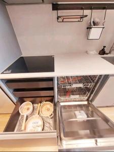 a kitchen with an empty drawer in a kitchen at Coex Stay in Seoul