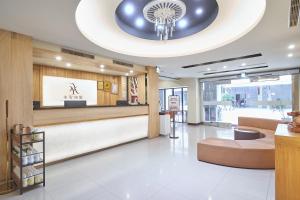 a lobby of a store with a reception desk at Yung An Business Hotel in Dounan
